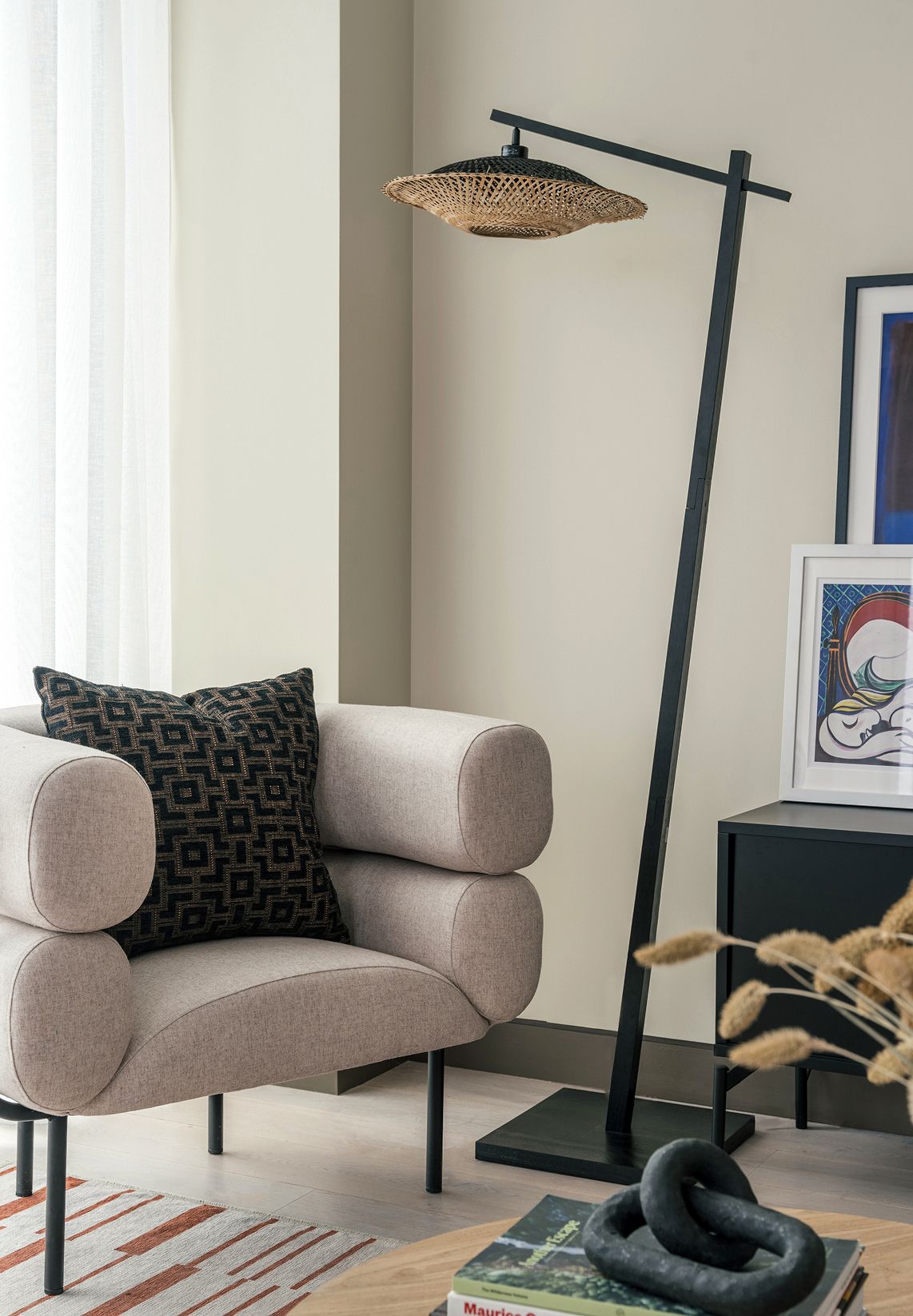 Image of a living room with a chair and free-standing lamp